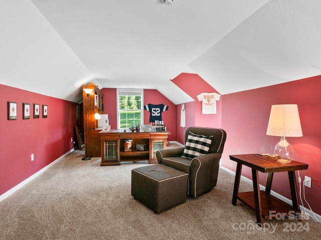 carpeted living room with lofted ceiling