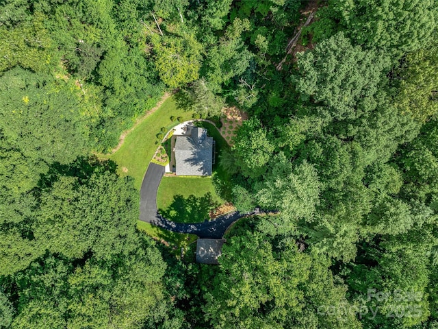 drone / aerial view with a view of trees