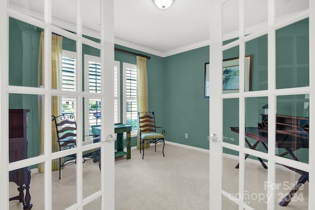 carpeted office space featuring french doors and ornamental molding