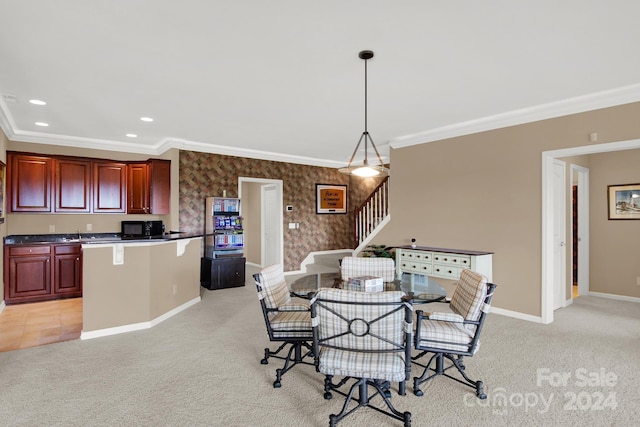 dining area featuring crown molding and light colored carpet