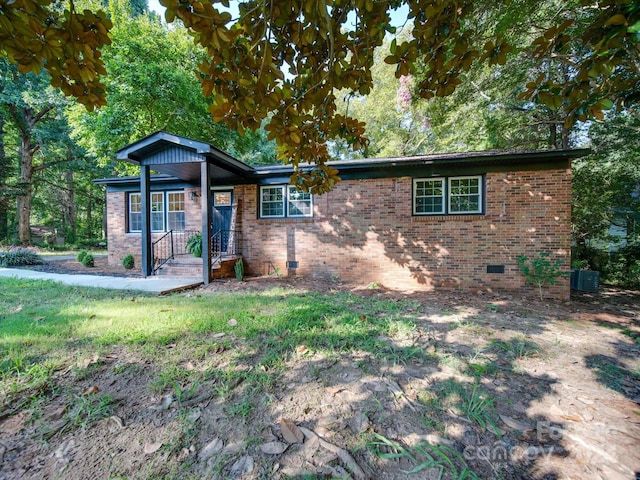 view of front of property with central AC unit