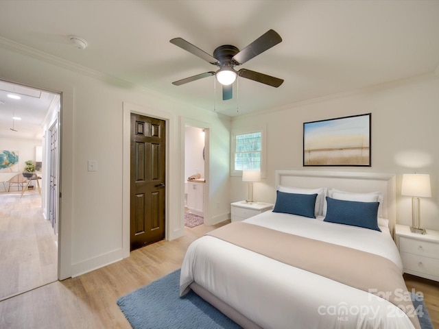 bedroom featuring ceiling fan, ensuite bathroom, light hardwood / wood-style floors, and ornamental molding