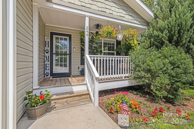 property entrance with covered porch