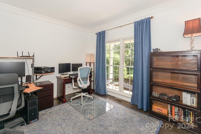 office area featuring ornamental molding, a healthy amount of sunlight, and dark wood-type flooring