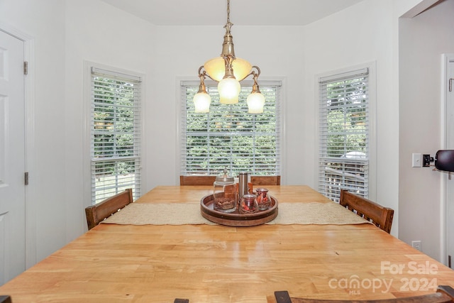 dining area with a notable chandelier and a healthy amount of sunlight