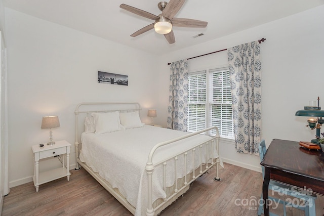 bedroom featuring ceiling fan and wood-type flooring