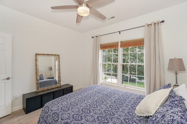 bedroom featuring light wood-type flooring and ceiling fan