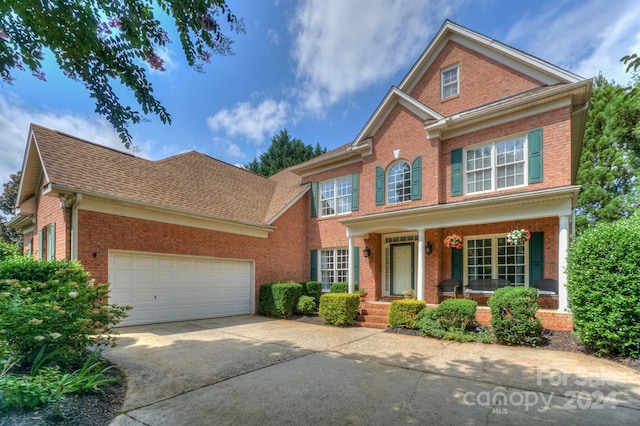 view of front of house with a garage and covered porch