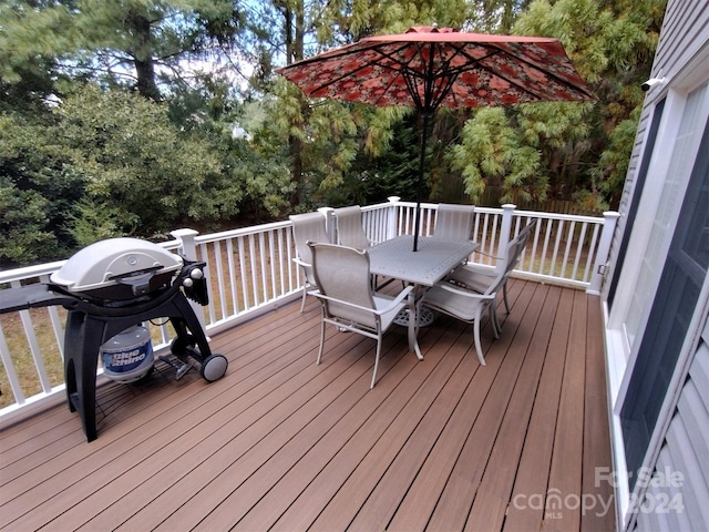 wooden terrace featuring grilling area