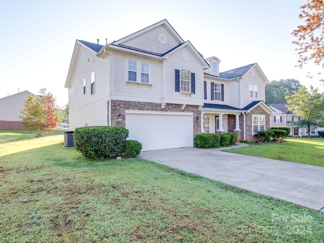 view of front facade with a garage, a front lawn, and cooling unit