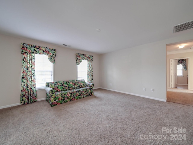 unfurnished room with carpet flooring