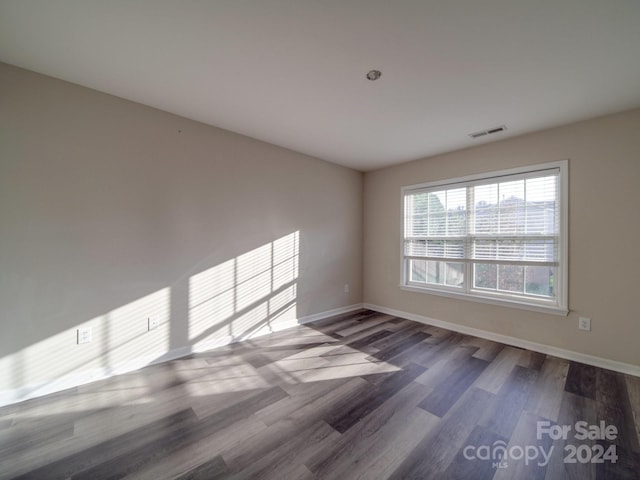 spare room with hardwood / wood-style flooring