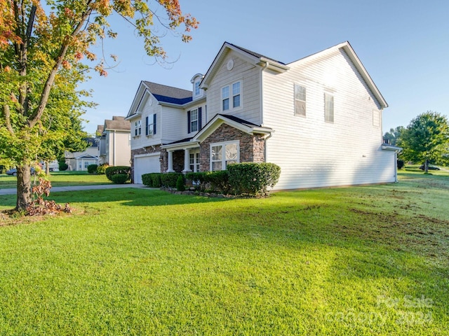 view of property exterior featuring a garage and a yard