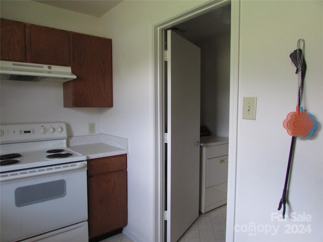 kitchen featuring washer / clothes dryer and white range with electric cooktop