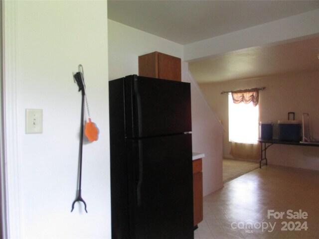 kitchen featuring black refrigerator