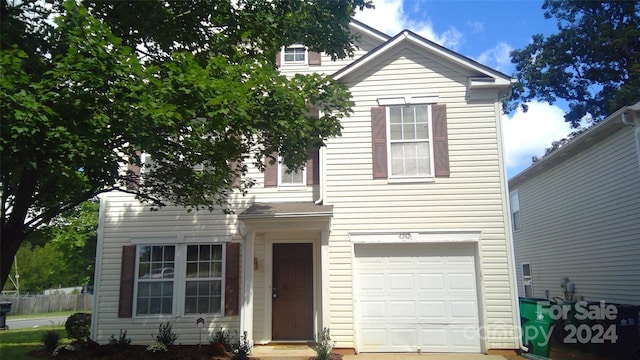 view of property featuring a garage