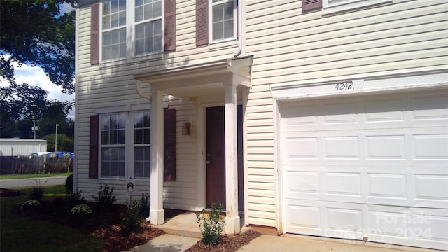 property entrance with a garage