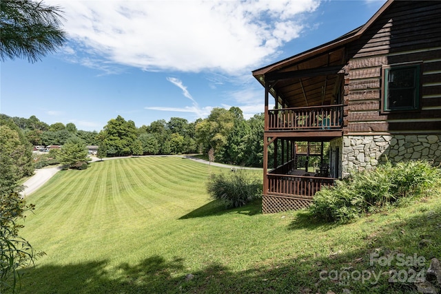 view of yard featuring a wooden deck