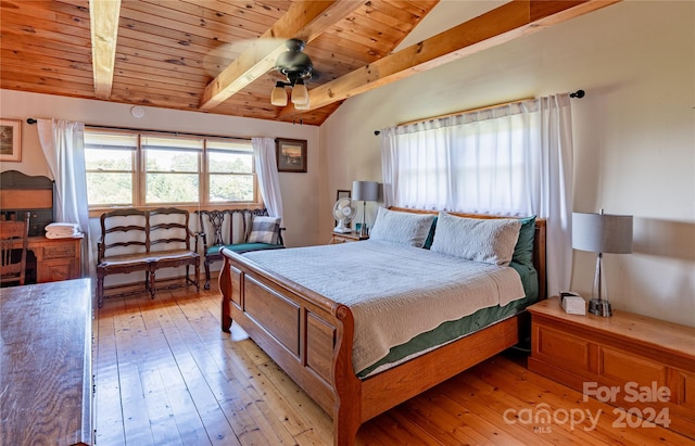 bedroom with lofted ceiling with beams, light wood-style floors, wood ceiling, and ceiling fan