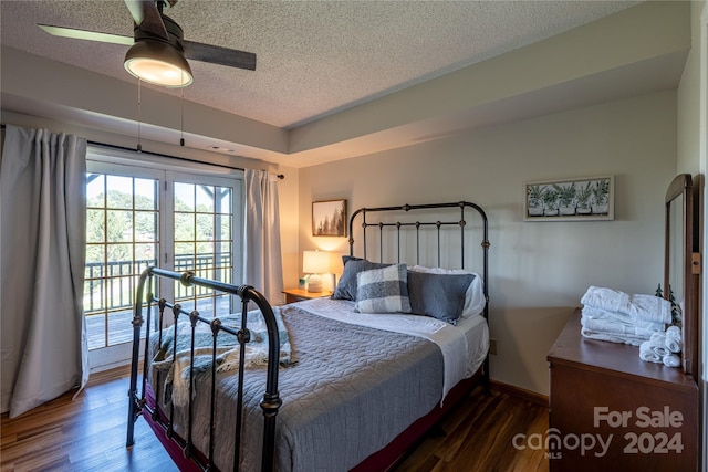 bedroom with ceiling fan, a textured ceiling, baseboards, and wood finished floors