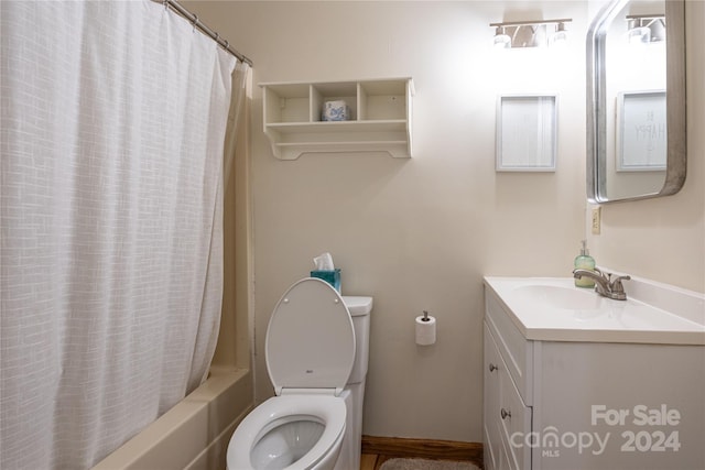 full bathroom featuring shower / bathtub combination with curtain, vanity, and toilet