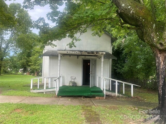 back of house with a yard