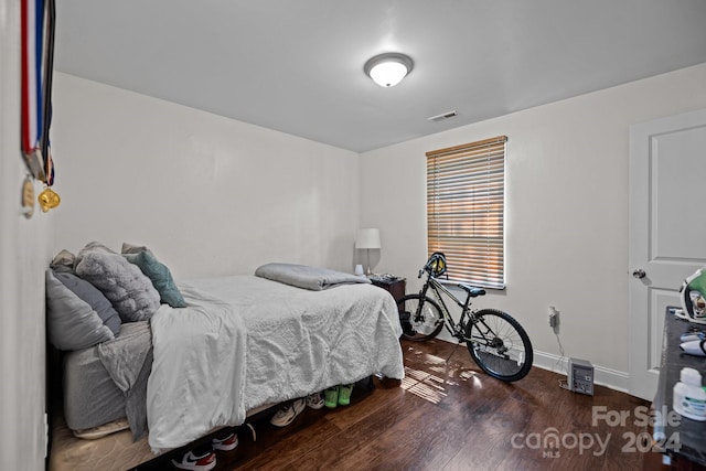 bedroom featuring dark hardwood / wood-style flooring