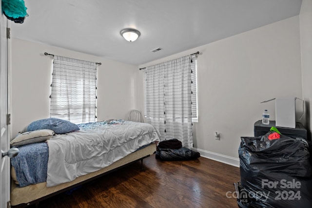 bedroom featuring dark hardwood / wood-style flooring