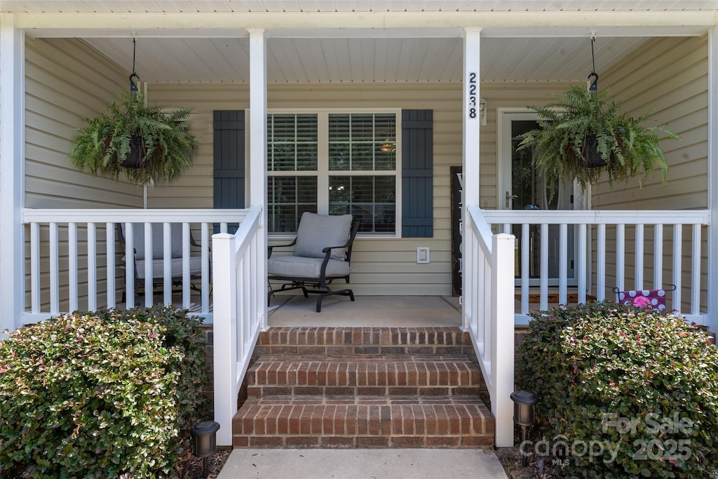 wooden terrace with covered porch