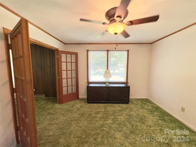 unfurnished bedroom featuring a closet, a textured ceiling, ceiling fan, and carpet flooring