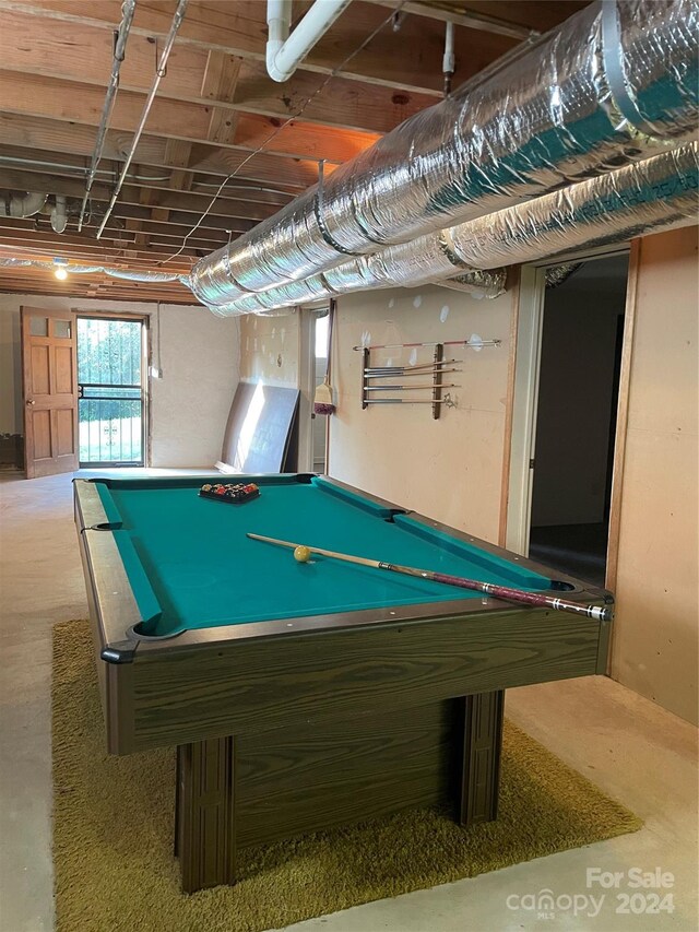 game room with concrete flooring and pool table