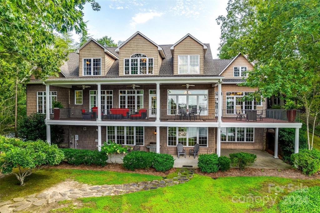 back of house featuring a balcony, ceiling fan, and a patio area