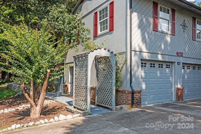 view of side of property with a garage