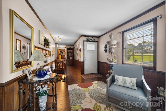 living room with crown molding and dark hardwood / wood-style flooring