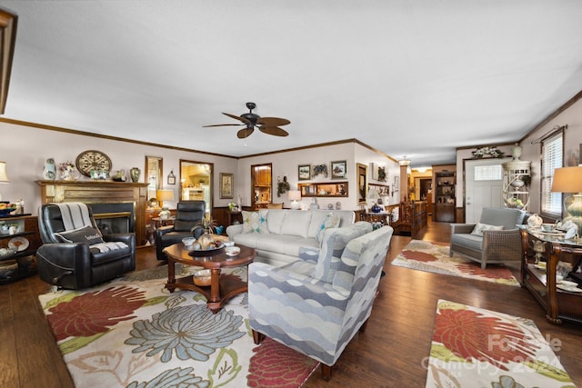 living room featuring ceiling fan, hardwood / wood-style floors, and ornamental molding