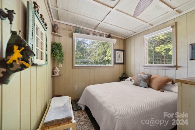 bedroom with wood walls