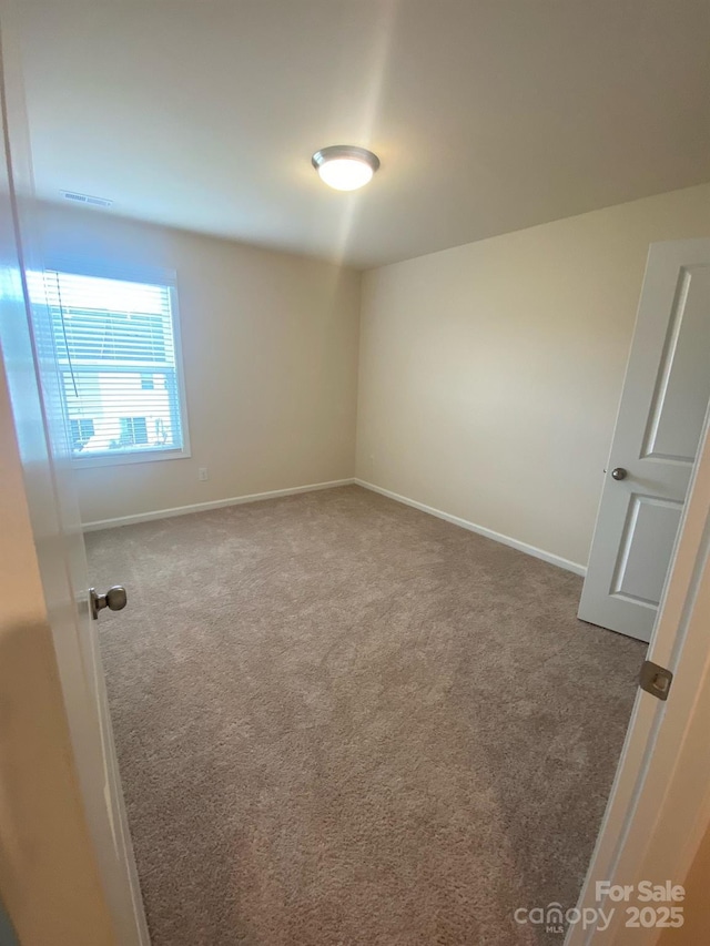 interior space featuring carpet, visible vents, and baseboards