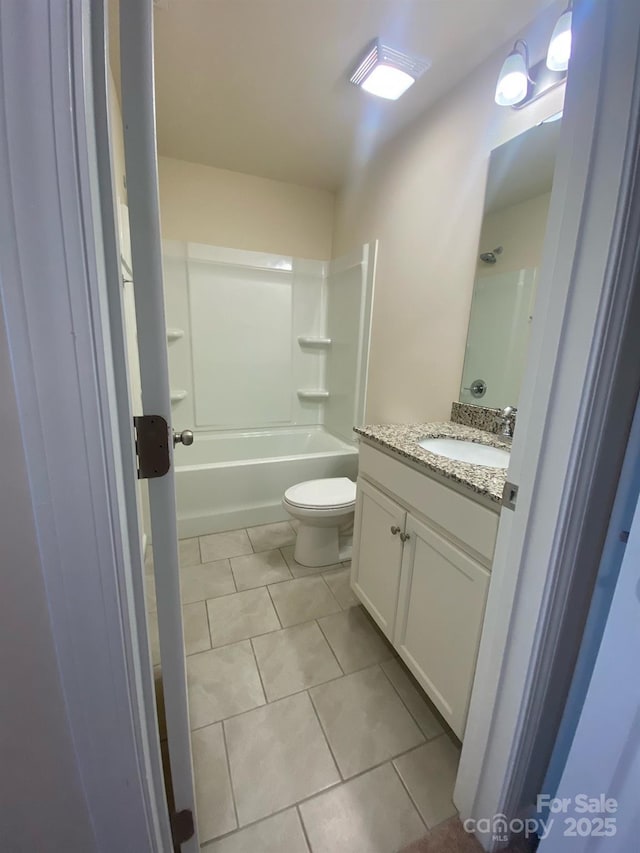 bathroom with vanity,  shower combination, tile patterned flooring, and toilet