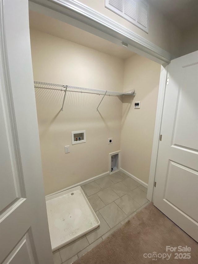 laundry area featuring washer hookup, visible vents, hookup for an electric dryer, laundry area, and baseboards