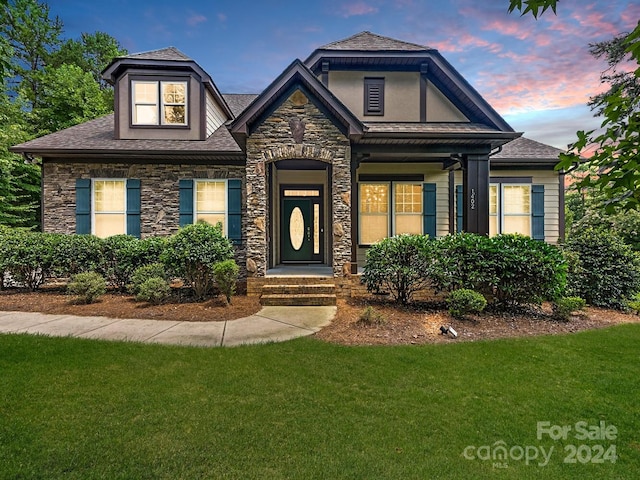 view of front of home with a lawn