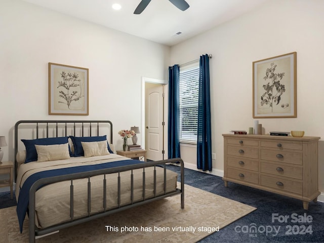 carpeted bedroom with ceiling fan