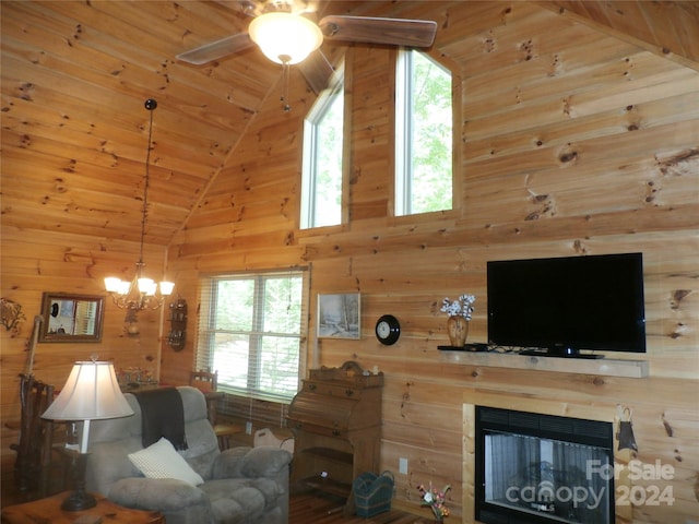 living room with wood walls, a multi sided fireplace, and wood ceiling