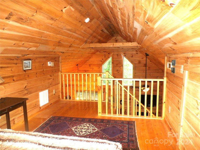 interior space with lofted ceiling, wooden ceiling, and wood-type flooring