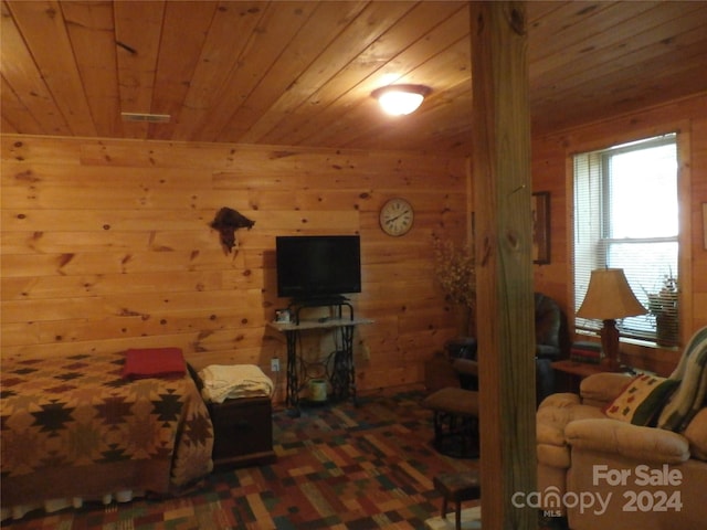 living room with wood walls and wooden ceiling