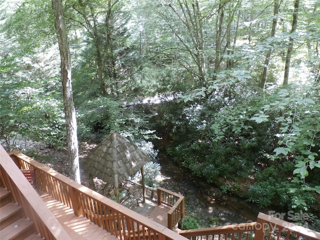 view of yard featuring a wooden deck and a gazebo