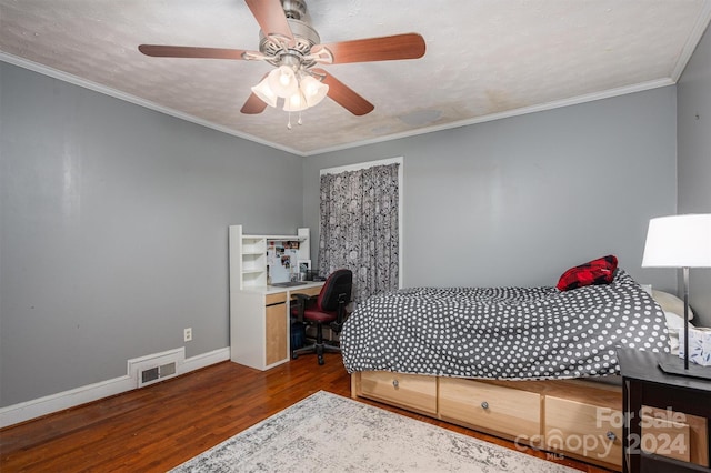 bedroom featuring baseboards, visible vents, wood finished floors, crown molding, and a textured ceiling