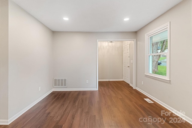 unfurnished bedroom with hardwood / wood-style flooring and a closet