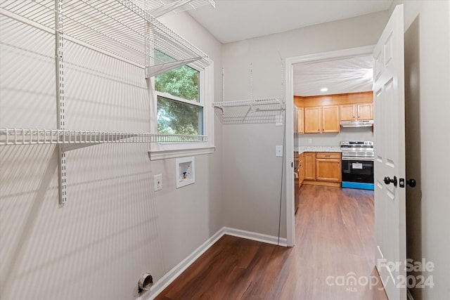 laundry room featuring washer hookup and dark hardwood / wood-style floors