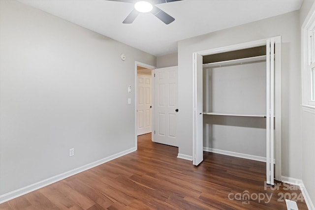 unfurnished bedroom with ceiling fan, a closet, and hardwood / wood-style floors