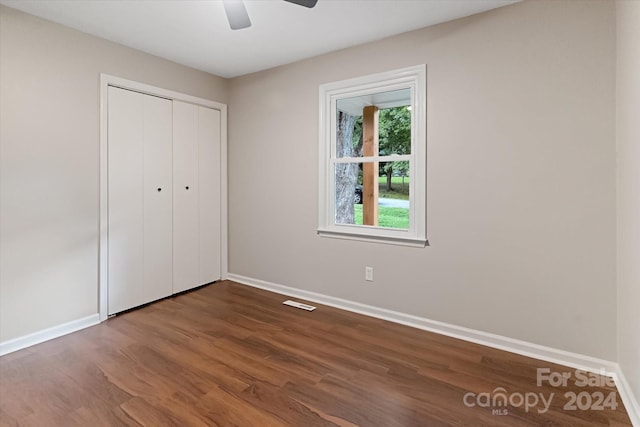 unfurnished bedroom with a closet, ceiling fan, and hardwood / wood-style flooring